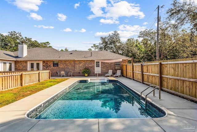 view of swimming pool featuring a patio area