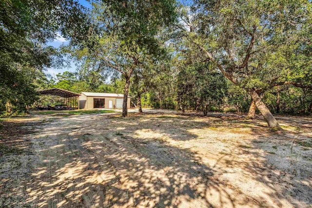 view of yard with a carport