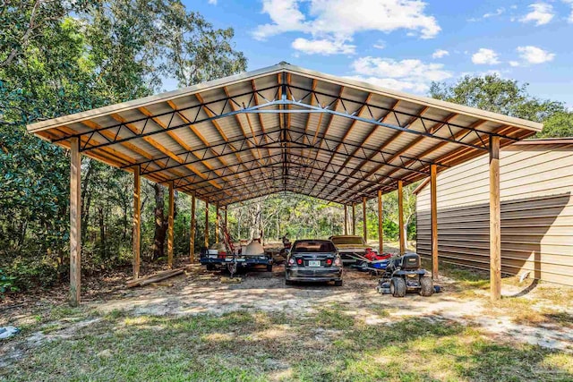 view of vehicle parking with a carport