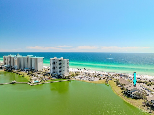 aerial view featuring a water view and a beach view