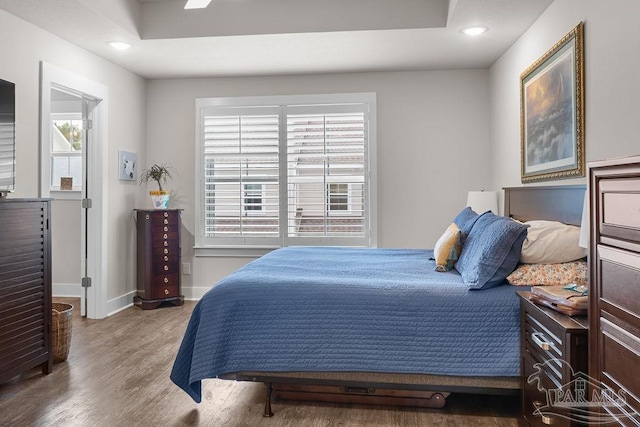 bedroom featuring hardwood / wood-style floors and ceiling fan