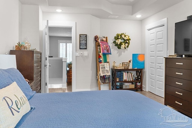 bedroom with a closet and light wood-type flooring