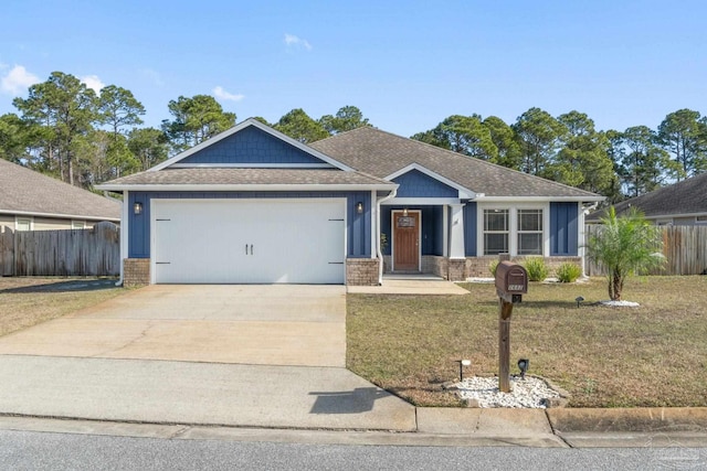 view of front of home featuring a garage and a front lawn