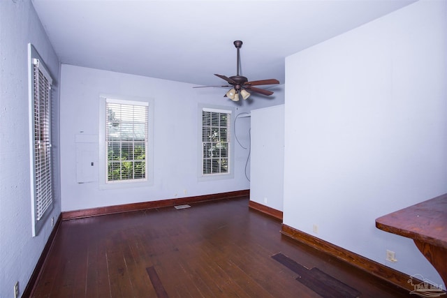 interior space featuring ceiling fan and dark hardwood / wood-style floors