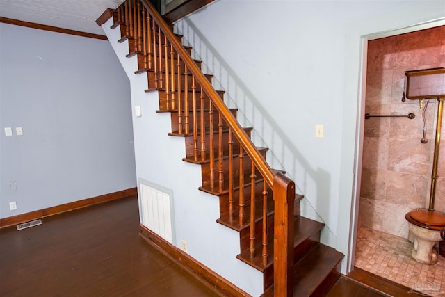 staircase featuring hardwood / wood-style flooring