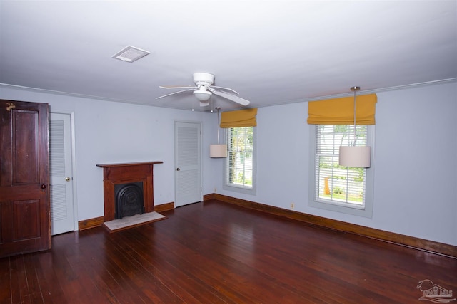 unfurnished living room with dark hardwood / wood-style floors and ceiling fan