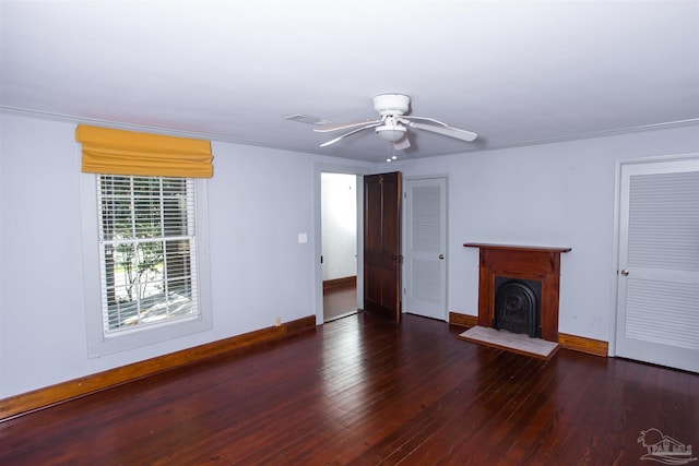 unfurnished living room with dark hardwood / wood-style floors and ceiling fan