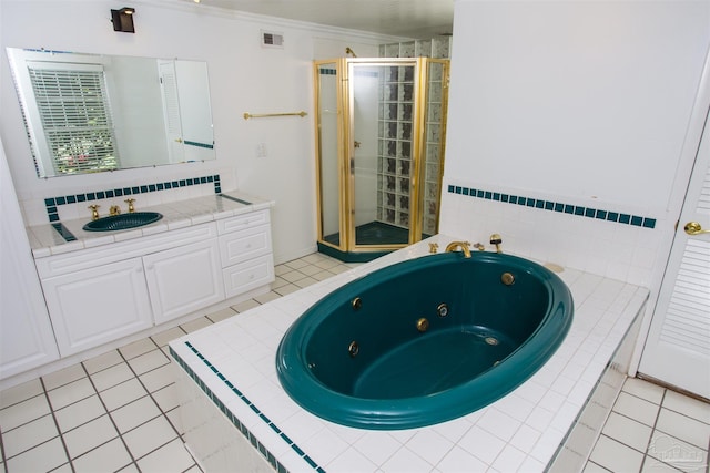 bathroom featuring vanity, crown molding, tile patterned floors, and separate shower and tub