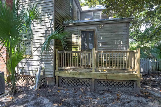 rear view of property with a wooden deck