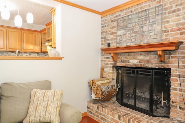 1609 N Spring St, Pensacola, FL 32501 - detailed view of crown molding, a brick fireplace, backsplash, a sink, and under cabinet range hood