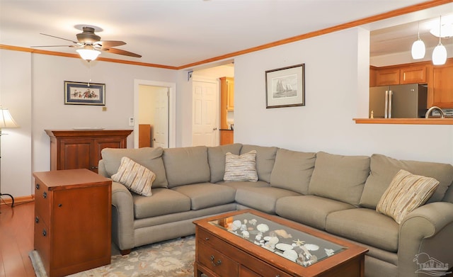 1609 N Spring St, Pensacola, FL 32501 - living room featuring a ceiling fan, ornamental molding, and light wood-type flooring