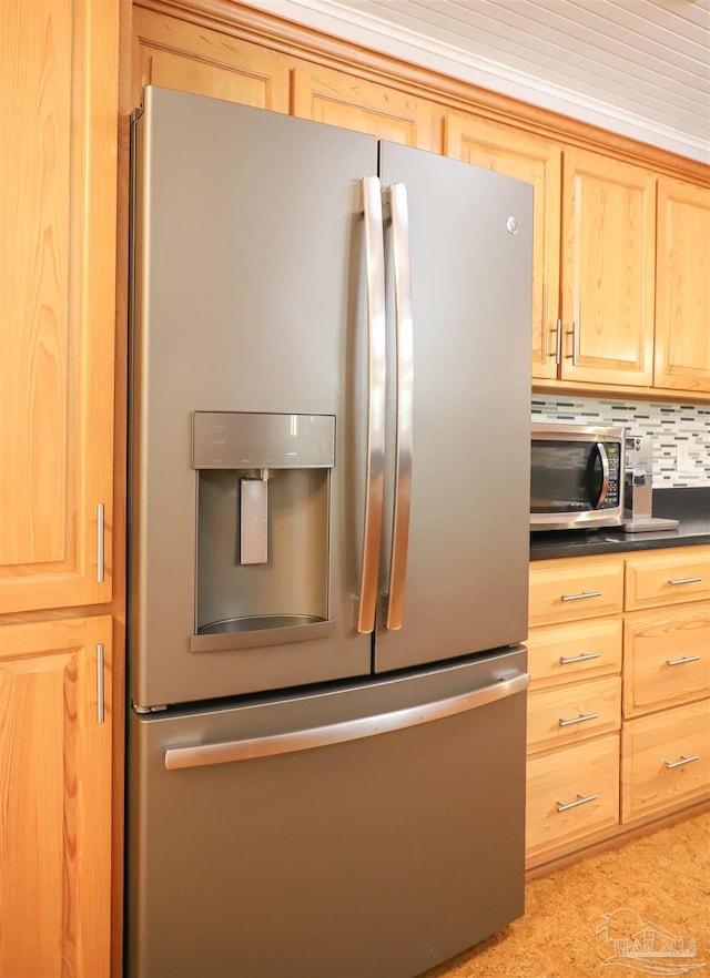 1609 N Spring St, Pensacola, FL 32501 - kitchen with appliances with stainless steel finishes, light brown cabinetry, dark countertops, and tasteful backsplash