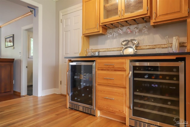 1609 N Spring St, Pensacola, FL 32501 - indoor dry bar featuring beverage cooler, light wood finished floors, and baseboards