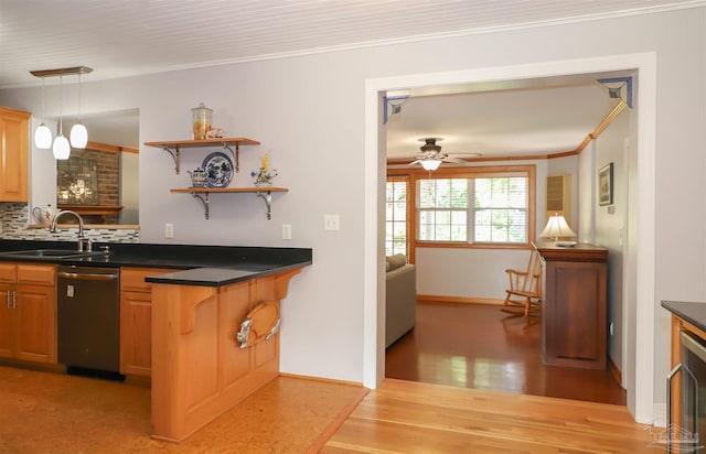 1609 N Spring St, Pensacola, FL 32501 - kitchen featuring a sink, dishwasher, dark countertops, crown molding, and decorative backsplash