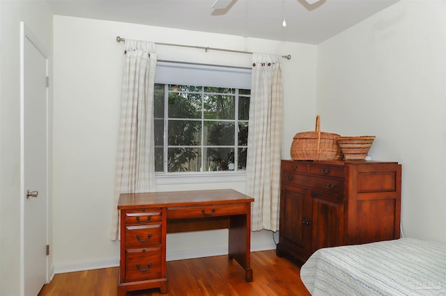 1609 N Spring St, Pensacola, FL 32501 - bedroom with wood finished floors, baseboards, and a ceiling fan