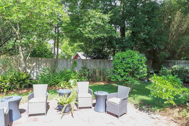 1609 N Spring St, Pensacola, FL 32501 - fenced backyard with a patio area