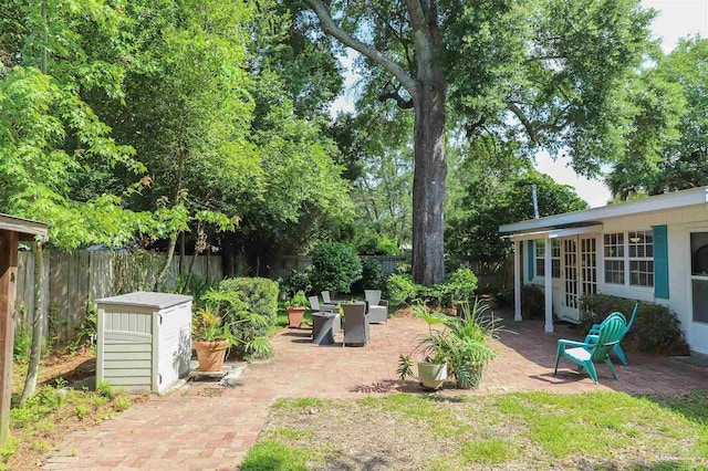 1609 N Spring St, Pensacola, FL 32501 - fenced backyard with a patio and french doors