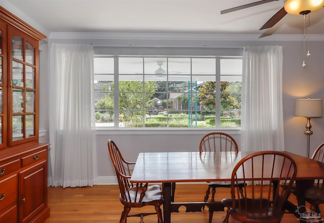 1609 N Spring St, Pensacola, FL 32501 - dining space with ceiling fan, light wood-style floors, plenty of natural light, and ornamental molding