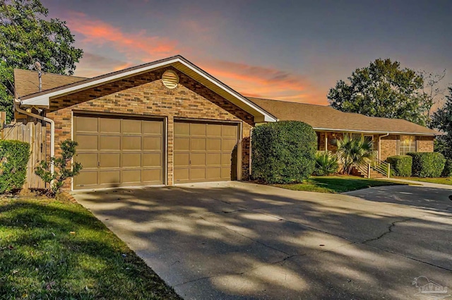 ranch-style home with a garage