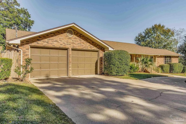 single story home featuring a garage