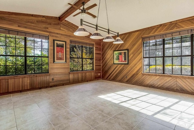 tiled empty room with vaulted ceiling with beams, wood walls, and ceiling fan