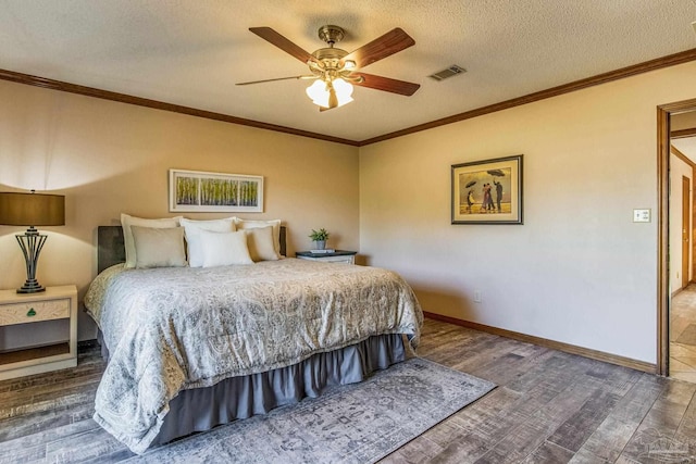 bedroom featuring ceiling fan, crown molding, a textured ceiling, and hardwood / wood-style flooring