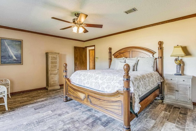 bedroom featuring hardwood / wood-style flooring, ceiling fan, ornamental molding, and a textured ceiling