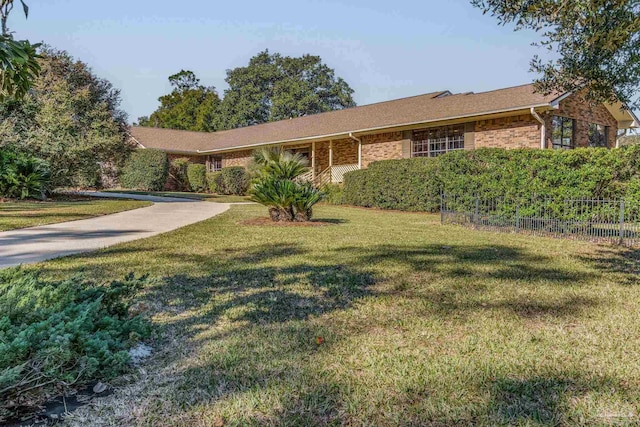 single story home with a front yard