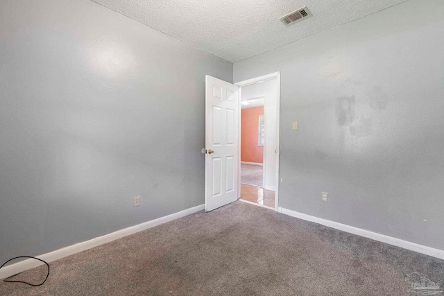 401 Ronda St, Pensacola, FL 32534 - empty room featuring carpet floors, baseboards, and a textured ceiling