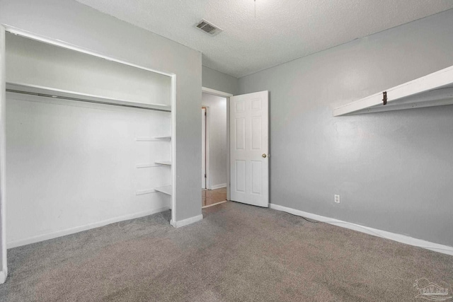401 Ronda St, Pensacola, FL 32534 - unfurnished bedroom with carpet flooring, a textured ceiling, baseboards, and a closet