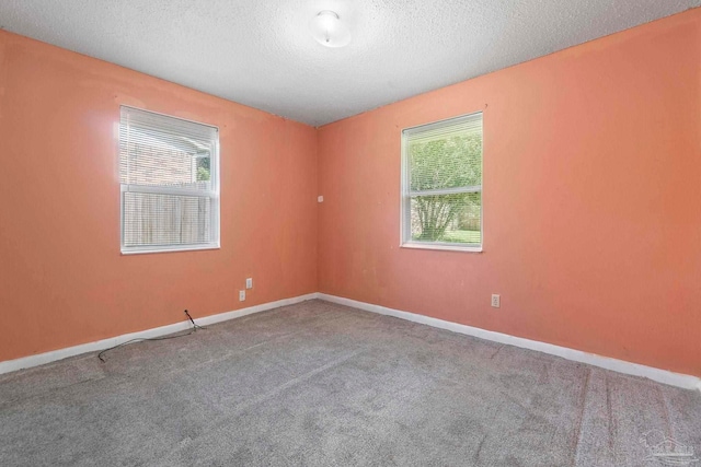 401 Ronda St, Pensacola, FL 32534 - unfurnished room with a textured ceiling, carpet, and baseboards
