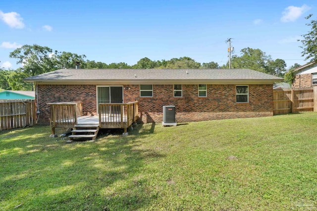401 Ronda St, Pensacola, FL 32534 - rear view of property featuring a wooden deck, central air condition unit, and brick siding