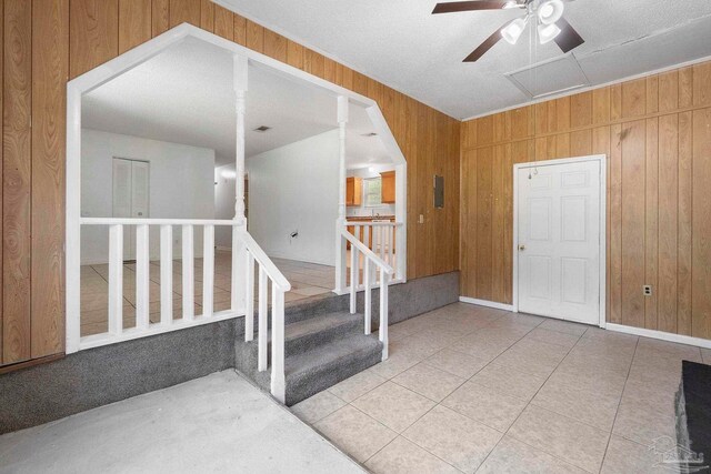 401 Ronda St, Pensacola, FL 32534 - foyer featuring wood walls, a ceiling fan, and tile patterned flooring