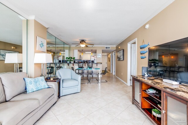 13817 Perdido Key Dr Unit 703, Pensacola, FL 32507 - living room with crown molding, ceiling fan, and light tile patterned floors