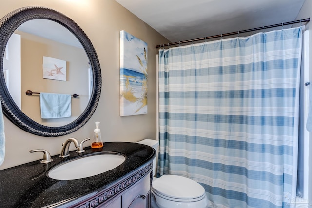 13817 Perdido Key Dr Unit 703, Pensacola, FL 32507 - bathroom featuring vanity, curtained shower, and toilet
