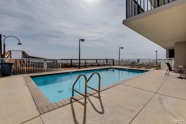 13817 Perdido Key Dr Unit 703, Pensacola, FL 32507 - view of pool featuring a patio