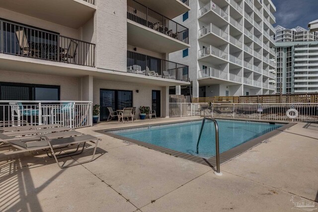 13817 Perdido Key Dr Unit 703, Pensacola, FL 32507 - view of swimming pool with a patio area