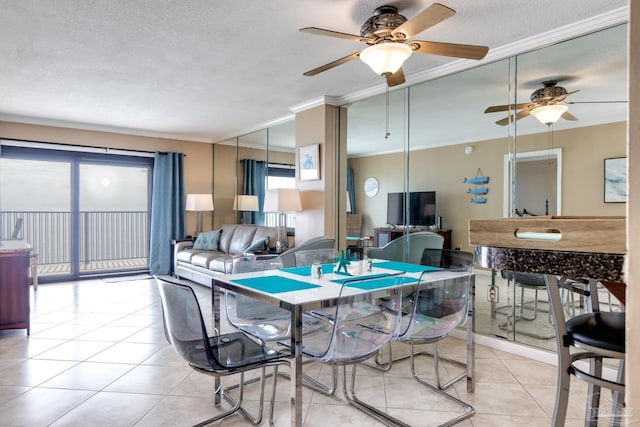 13817 Perdido Key Dr Unit 703, Pensacola, FL 32507 - dining room with light tile patterned flooring, ornamental molding, and a textured ceiling
