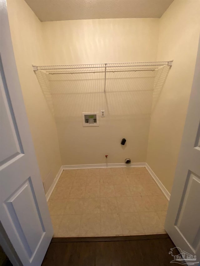 laundry area with hookup for a washing machine, gas dryer hookup, and hookup for an electric dryer