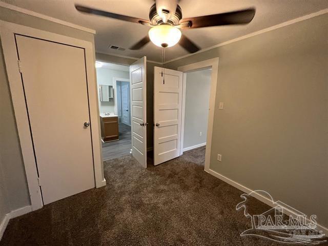 interior space with ceiling fan