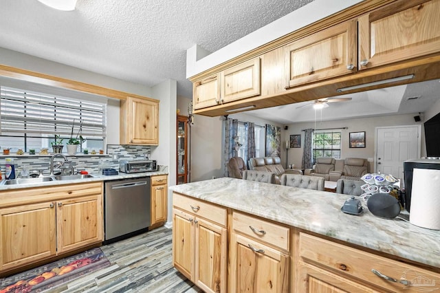 5590 Meadow Creek Pl, Gulf Breeze, FL 32563 - kitchen with dishwasher, ceiling fan, light wood-style flooring, open floor plan, and light brown cabinetry