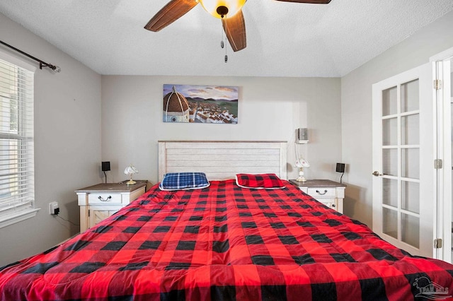 5590 Meadow Creek Pl, Gulf Breeze, FL 32563 - bedroom with a textured ceiling and a ceiling fan