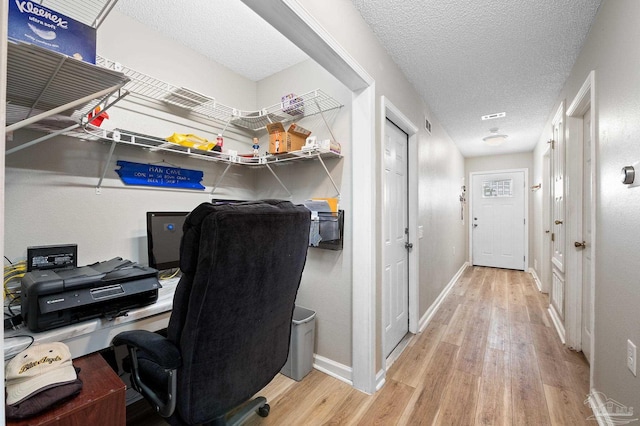 5590 Meadow Creek Pl, Gulf Breeze, FL 32563 - office featuring wood finished floors and a textured ceiling