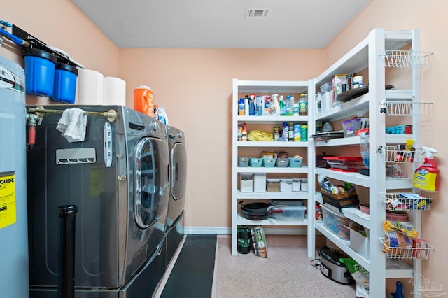 5590 Meadow Creek Pl, Gulf Breeze, FL 32563 - laundry room featuring washing machine and dryer and gas water heater