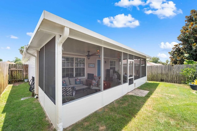 5590 Meadow Creek Pl, Gulf Breeze, FL 32563 - back of property featuring a sunroom, a fenced backyard, and a ceiling fan