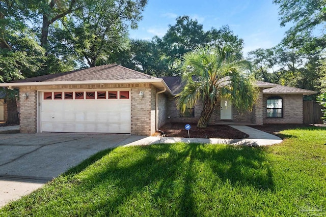 view of front of house with a front lawn and a garage