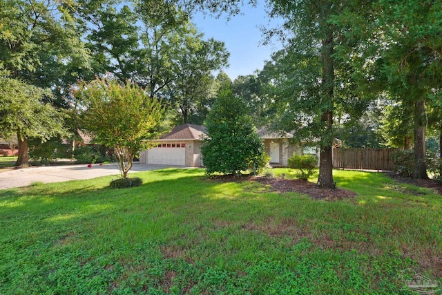 view of front facade with a garage and a front lawn