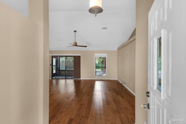 empty room featuring wood-type flooring, lofted ceiling, and ceiling fan