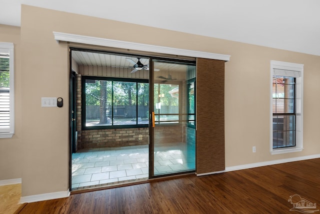 doorway to outside featuring hardwood / wood-style flooring and a wealth of natural light