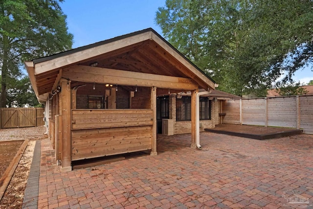 view of patio / terrace with an outbuilding